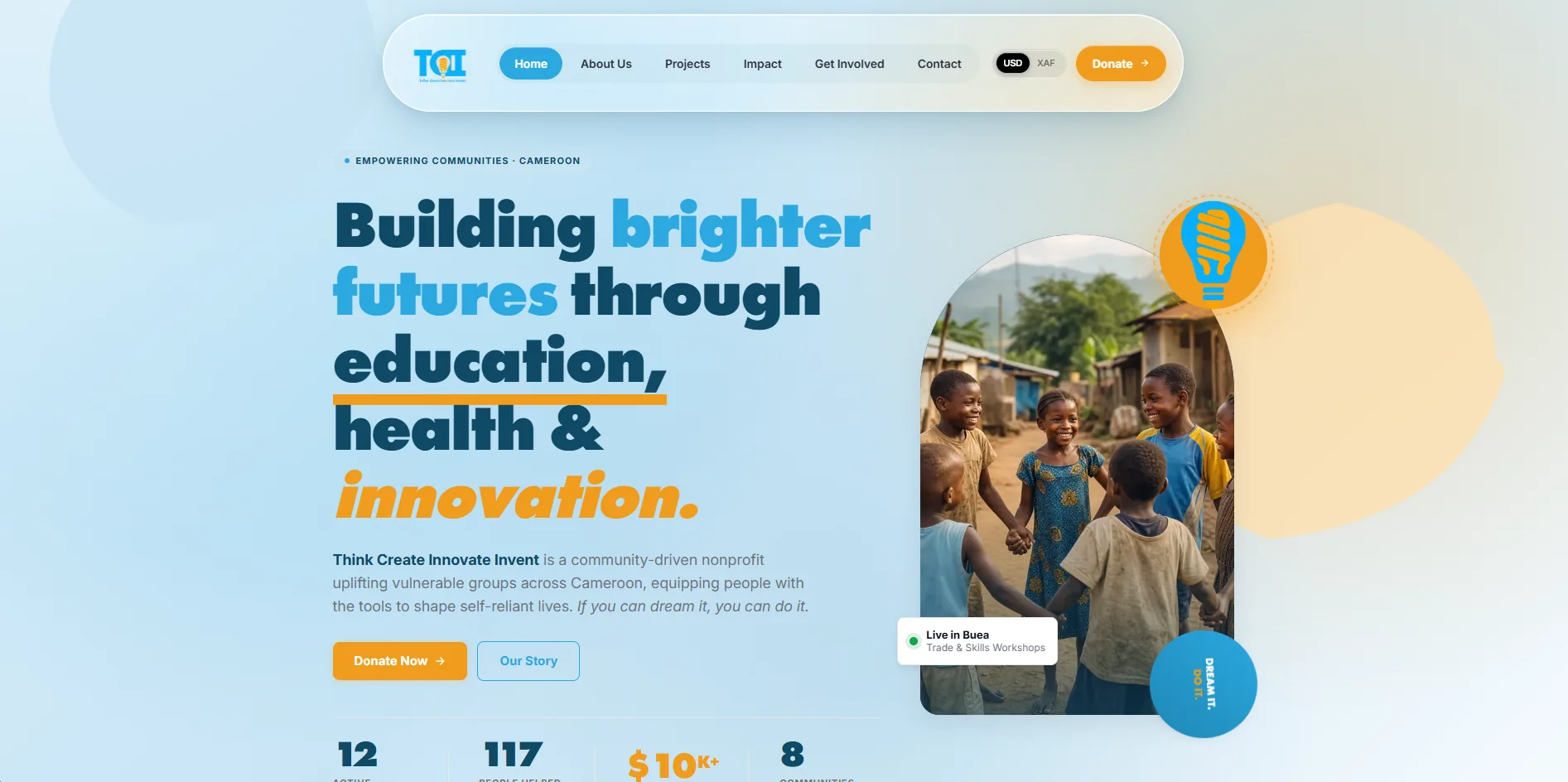 The TCII homepage, with a currency switcher in the nav beside the headline and a photograph of children in Cameroon